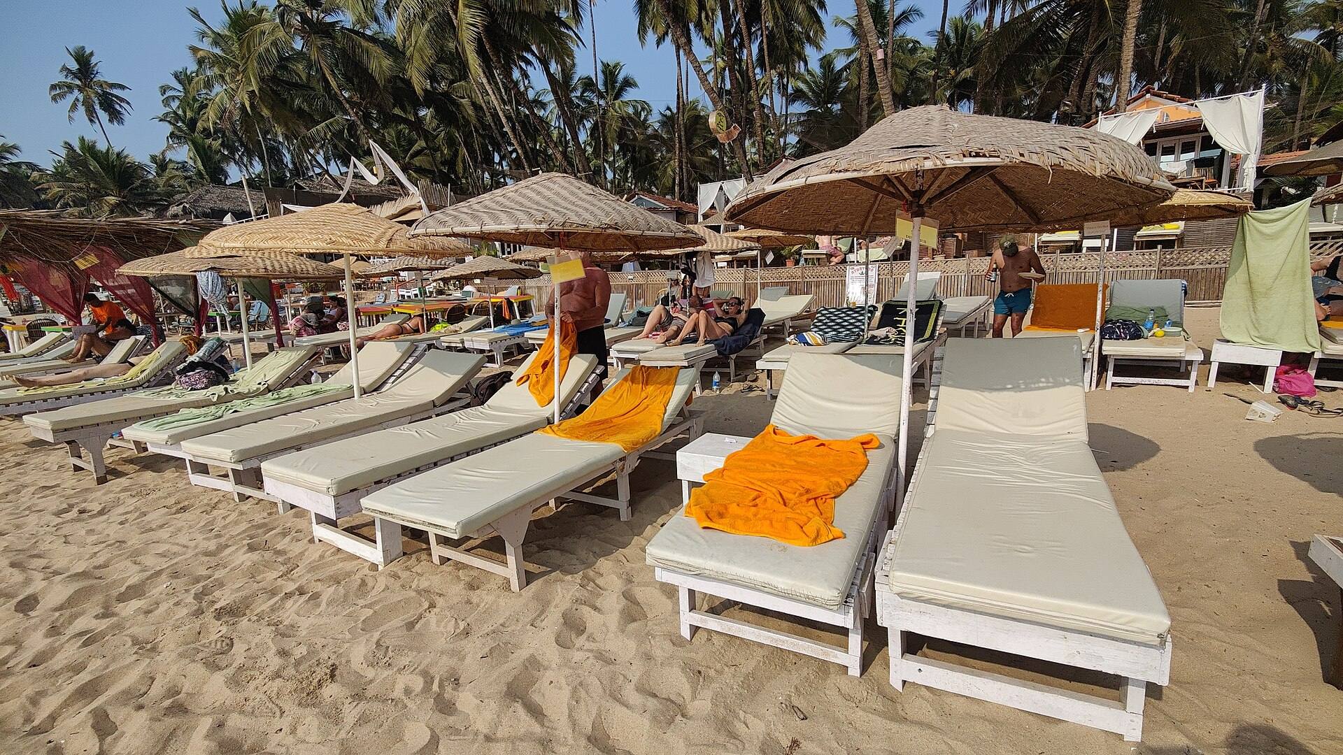 Sun loungers and umbrellas on Palolem beach, Goa