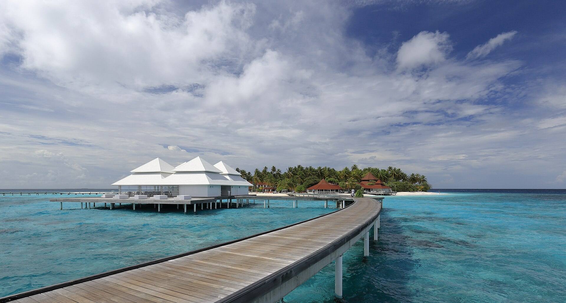 Water villas on stilts over a turquoise lagoon